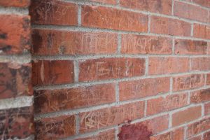 graffiti on sandblasted brick